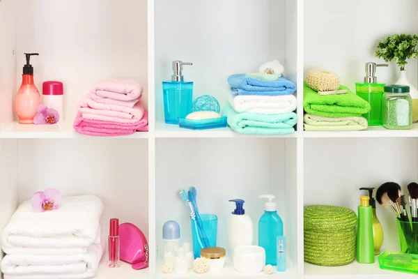 Bath accessories on shelfs in bathroom — Stock Photo, Image