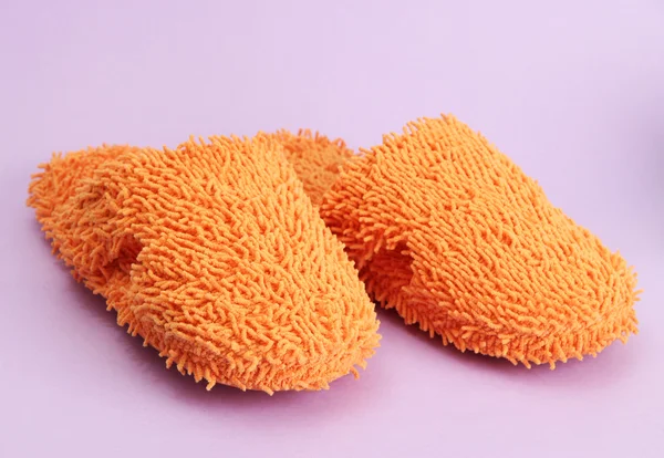 Bright slippers, on purple background — Stock Photo, Image