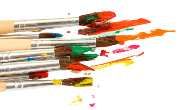 Paint brushes with gouache isolated on white