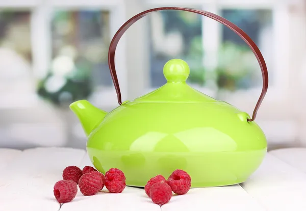 Tea with raspberries on table on bright background — Stock Photo, Image