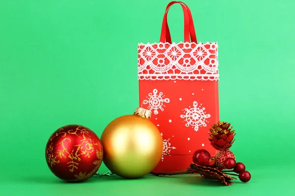 Christmas paper bag for gifts on green background — Stock Photo, Image