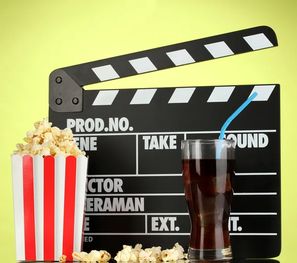Movie clapperboard, cola and popcorn on background — Stock Photo, Image