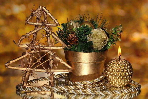 Christmas composition with candles and decorations in gold color on bright background — Stock Photo, Image