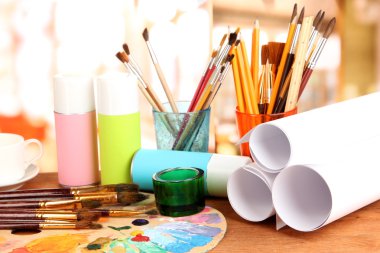 Artistic equipment: paint, brushes and art palette clipart