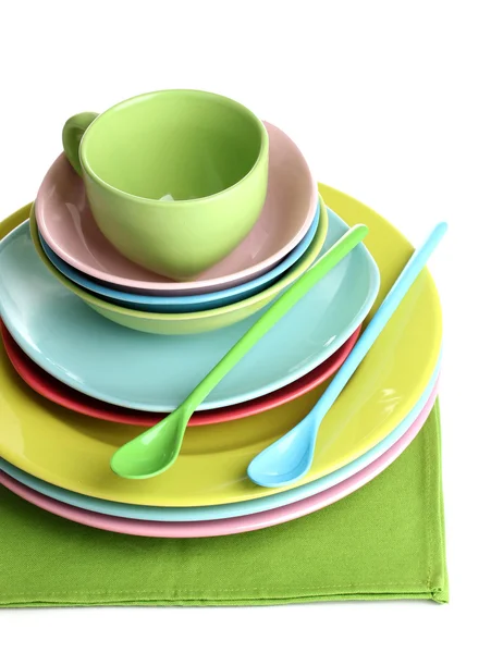 Colorful plates on napkin isolated on white — Stock Photo, Image