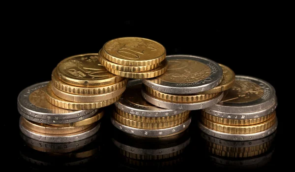 Euro coins isolated on black — Stock Photo, Image