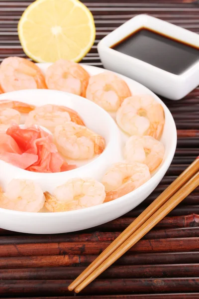 Prawns on plate with chopsticks and sauce — Stock Photo, Image