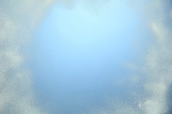 Snö på blå bakgrund — Stockfoto