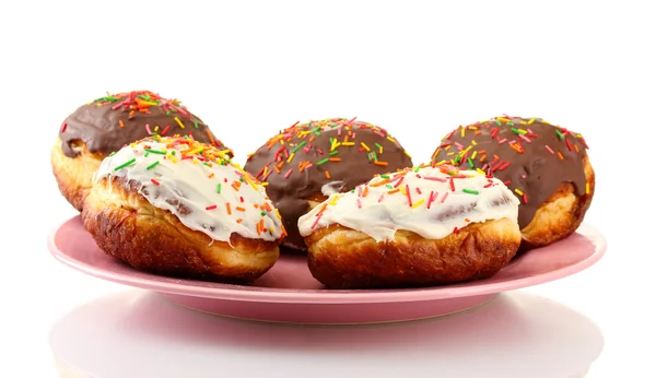 Tasty donuts on color plate isolated on white — Stock Photo, Image