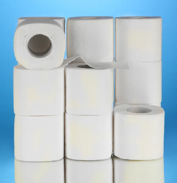 Rolls of toilet paper on blue background — Stock Photo, Image