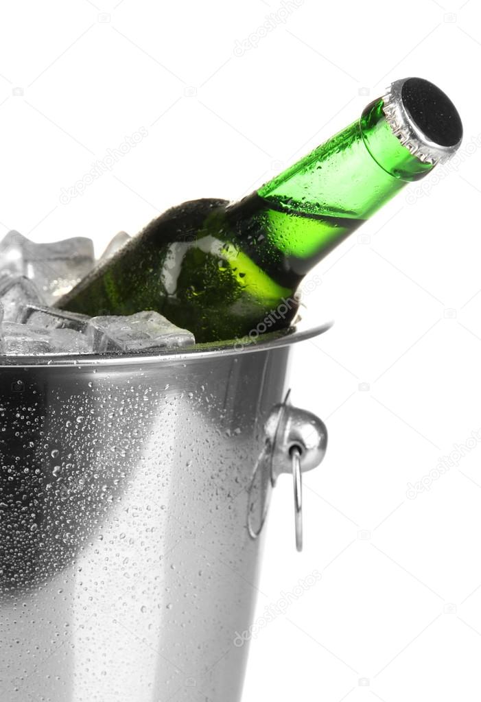 Beer bottle in ice bucket isolated on white