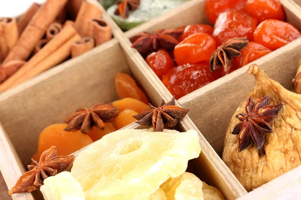 Dried fruits and cinnamon with anise stars in box close-up — Stock Photo, Image