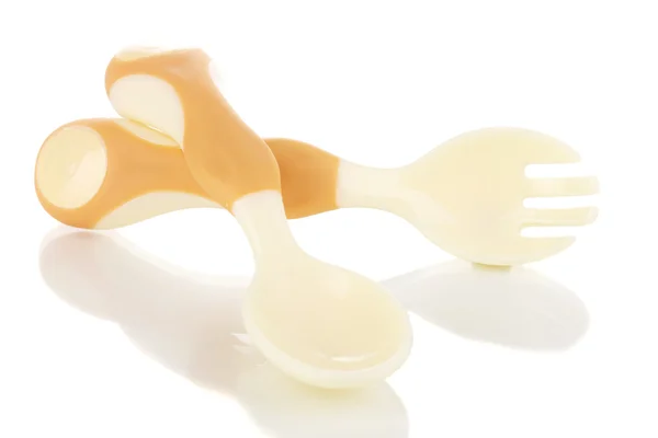 Cucchiaio e forchetta beige per neonati isolati su bianco — Foto Stock