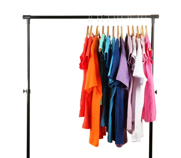 Choice of clothes of different colors on wooden hangers, isolated on white — Stock Photo, Image