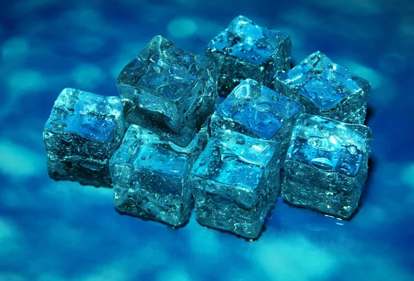 Ice cubes on color background — Stock Photo, Image