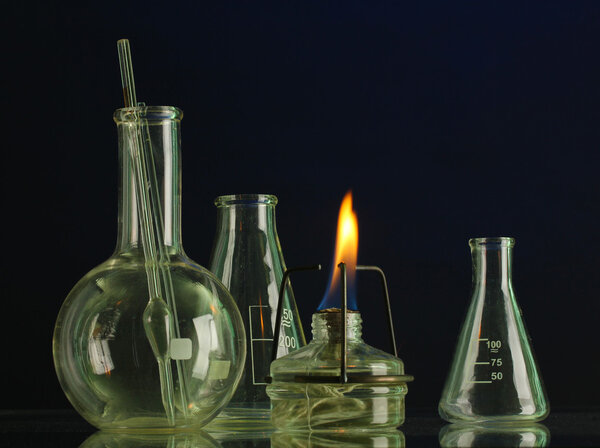 spiritlamp and test-tubes on blue background