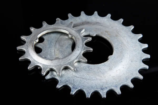 Metal cogwheels on black background — Stock Photo, Image