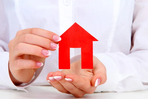 Concept: woman hands with paper house, close up — Stock Photo, Image