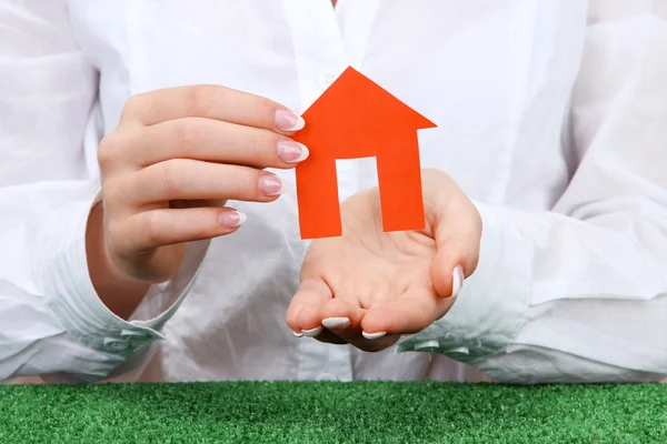 Concept: woman hands with paper house, close up — Stock Photo, Image