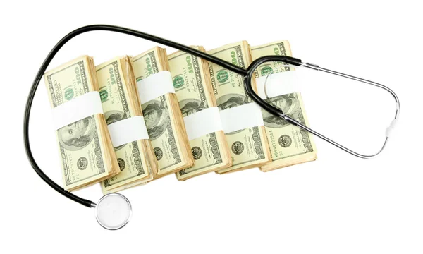 Healthcare cost concept: stethoscope and dollars isolated on white — Stock Photo, Image