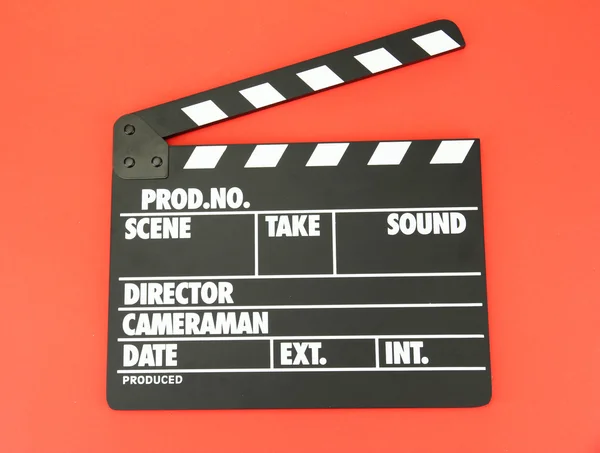 Produção de filmes clapper board em fundo de cor — Fotografia de Stock