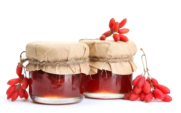 Ripe barberries and jars of jam isolated white — Stock Photo, Image