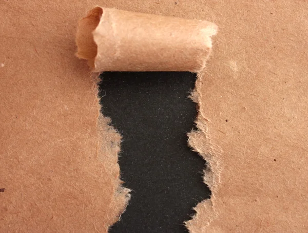 引き裂かれたクラフト用紙の背景 — ストック写真