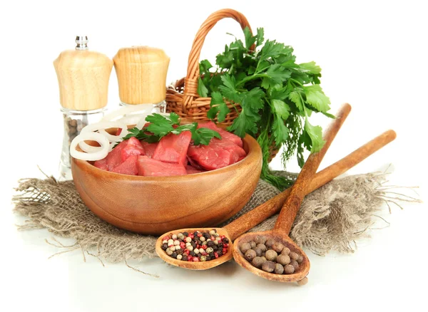 Raw beef meat in bowl with herbs and spices isolated on white — Stock Photo, Image