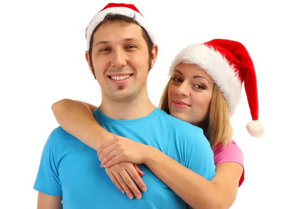 Coppia amorevole in Babbo Natale cappelli isolati su bianco — Foto Stock