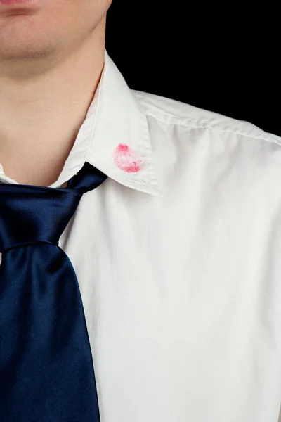 Lipstick kiss on shirt collar of man, isolated on black — Stock Photo, Image