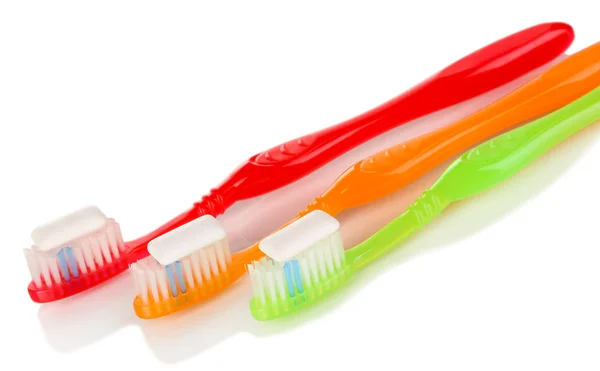 Toothbrushes and chewing gum isolated on white — Stock Photo, Image