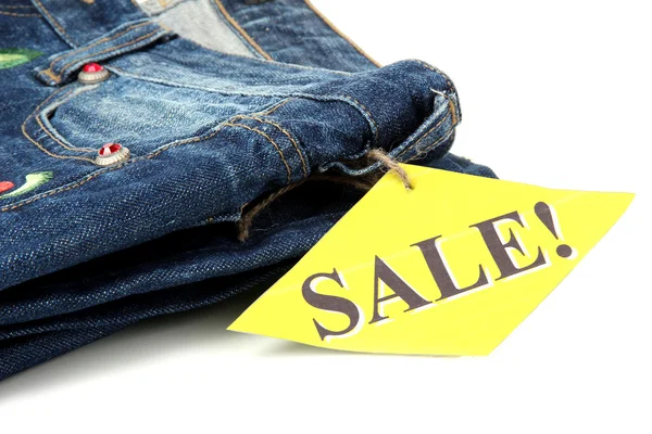 Moteblå jeans på salg, isolert på hvit – stockfoto