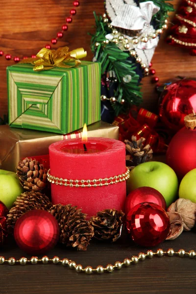 Composition from Christmas decorations close-up on wooden table on wooden background — Stock Photo, Image