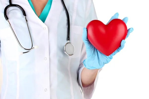 Doctor con el corazón en la mano. aislado en blanco — Foto de Stock