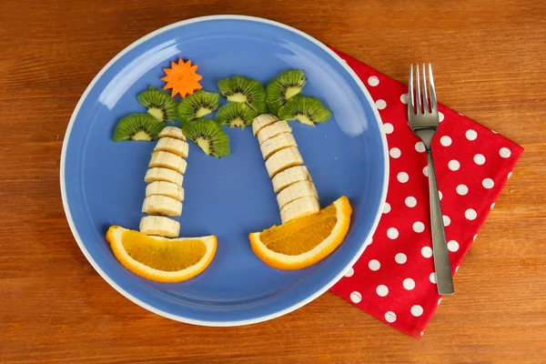 Fun food for kids on wooden background — Stock Photo, Image
