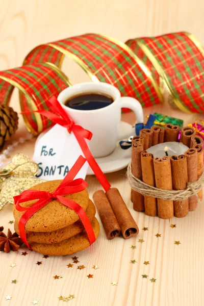 Cookies for Santa: Conceptual image of ginger cookies, milk and christmas decoration on light background — Stock Photo, Image