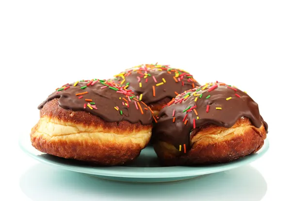 Tasty donuts on color plate isolated on white — Stock Photo, Image