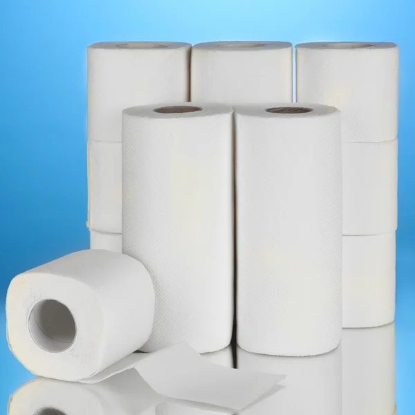 Rolls of toilet paper on blue background — Stock Photo, Image