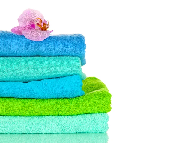 Stack of towels with fragrant flower isolated on white — Stock Photo, Image