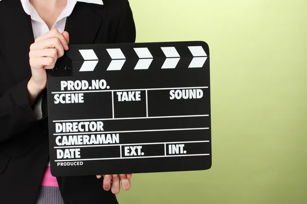 Movie production clapper board on color background — Stock Photo, Image