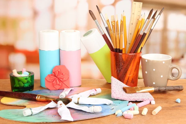 Artistic equipment: paint, brushes and art palette — Stock Photo, Image