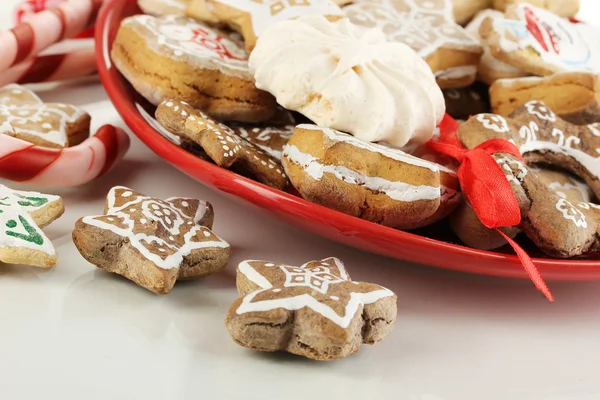 Christmas treats on plate isolated on white — Stock Photo, Image