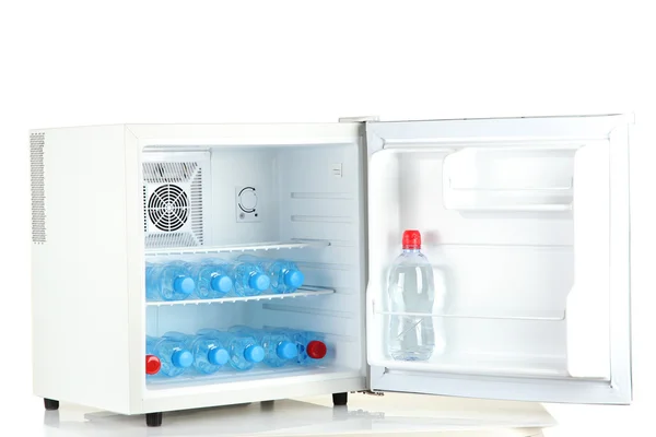 Mini fridge full of bottled water isolated on white — Stock Photo, Image