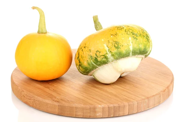 Two pumpkins on wooden board isolated on white — Stock Photo, Image