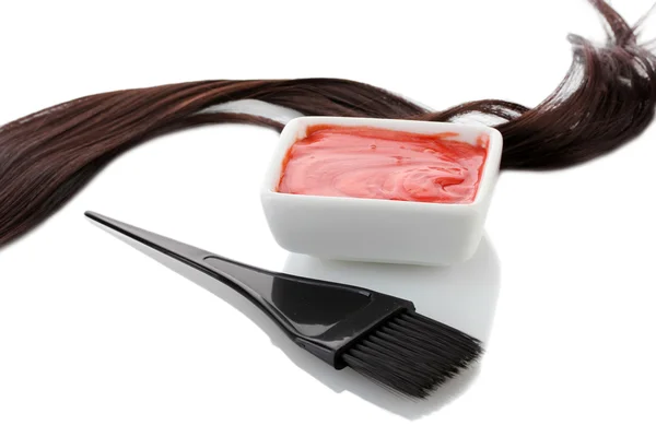 Bowl with hair dye and black brush on white background close-up — Stock Photo, Image