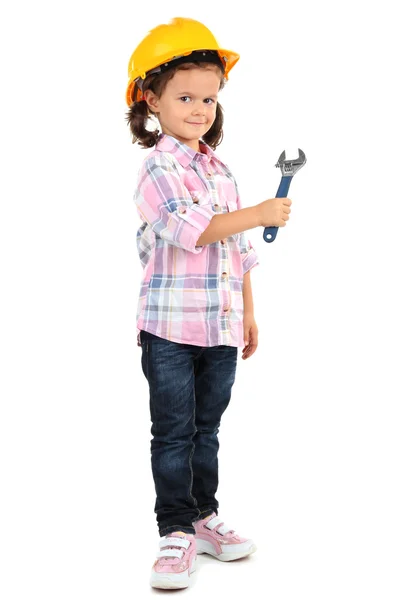 Beautiful little girl in helmet with wrench isolated on white — Stock Photo, Image