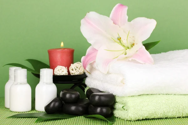 Beautiful spa setting on green background — Stock Photo, Image