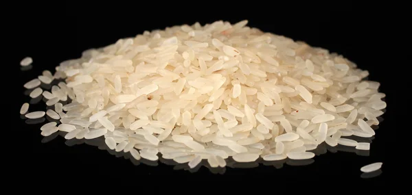 Biały ryż szlifowany na czarnym tle — Zdjęcie stockowe