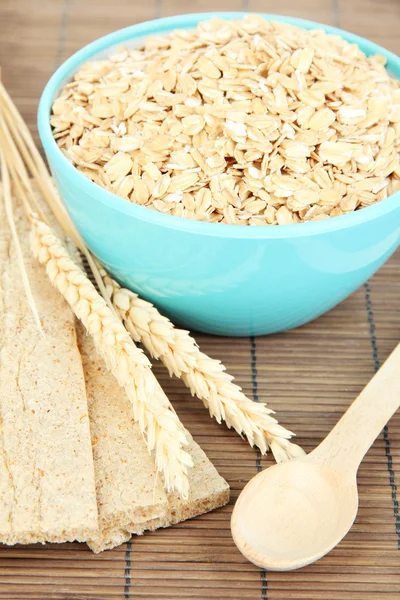 Blue bowl full of oat flakes — Stock Photo, Image