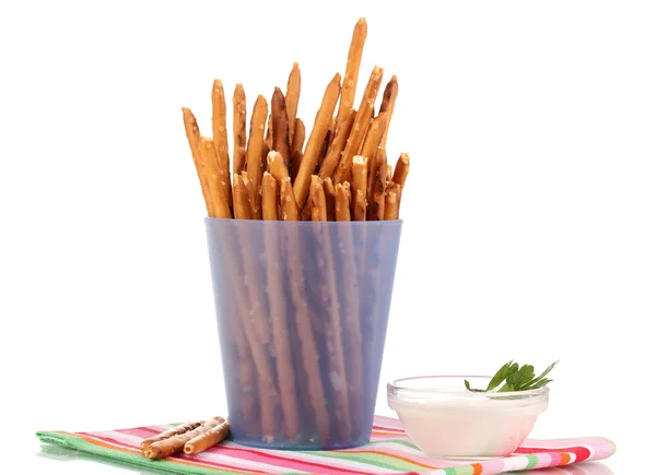 Tasty crispy sticks in purple plastic cup isolated on white — Stock Photo, Image